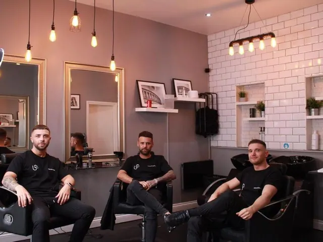 The team in the shop, under Edison-bulb lights